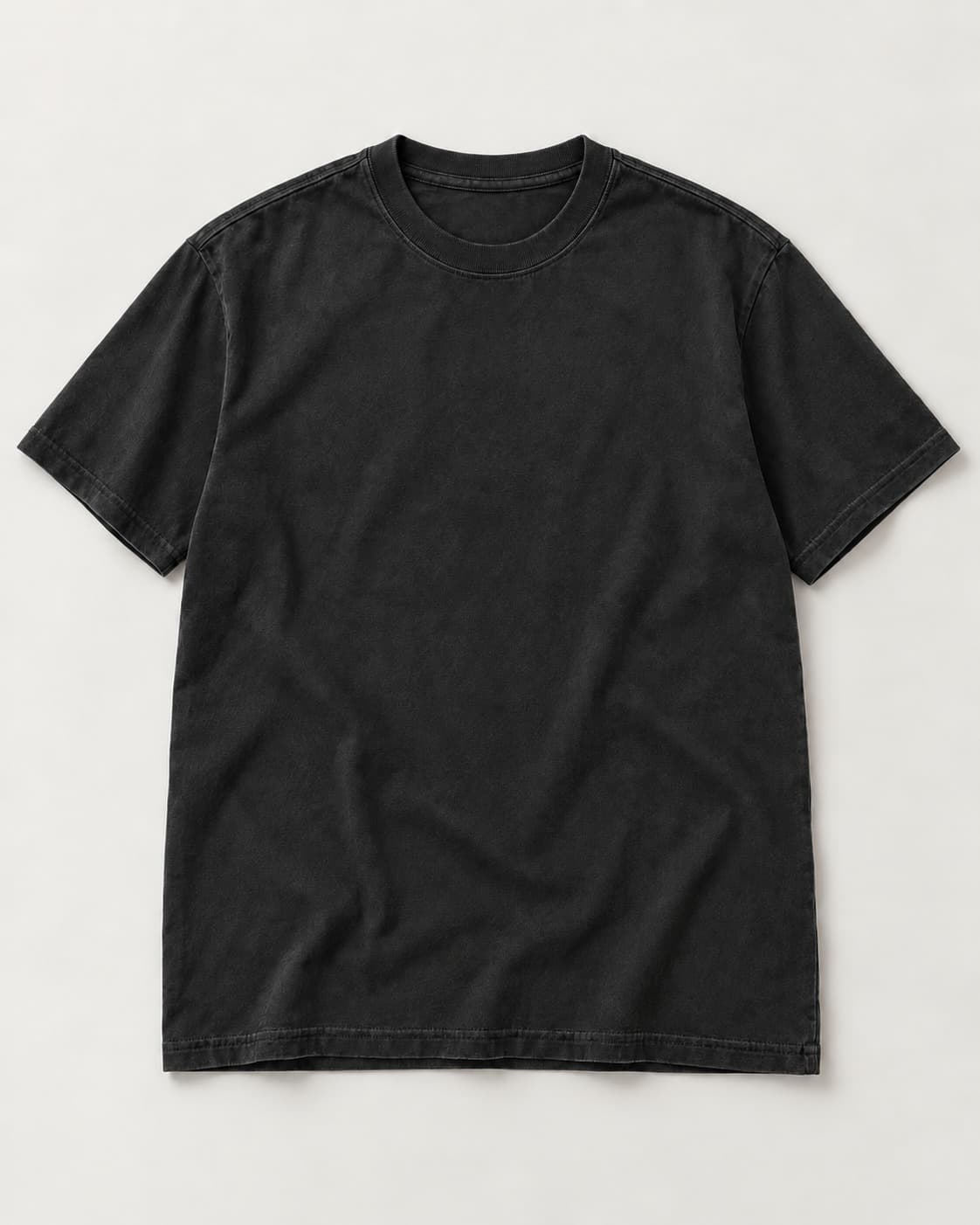 Illustrative ink-colored tee blank for previewing artwork placement